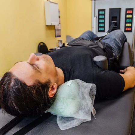 Patient Receiving Spinal Decompression Therapy Service Box