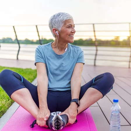 Woman Stretching on a Yoga Mat Mobility Stretching Service Box
