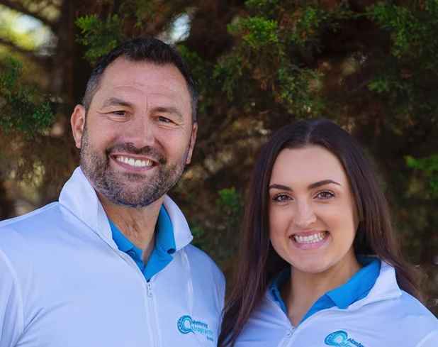 Brian Rector and Madison Ferrante Pose Outside In Their Office Swag