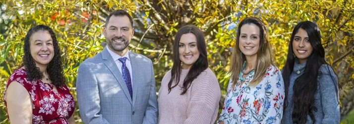 Chiropractor-Monterey-CA-Brian-Rector-and-Madison-Ferrante-and-Team-Welcome-New-Patients-to-the-Clinic.webp low back pain relief with chiropractic care